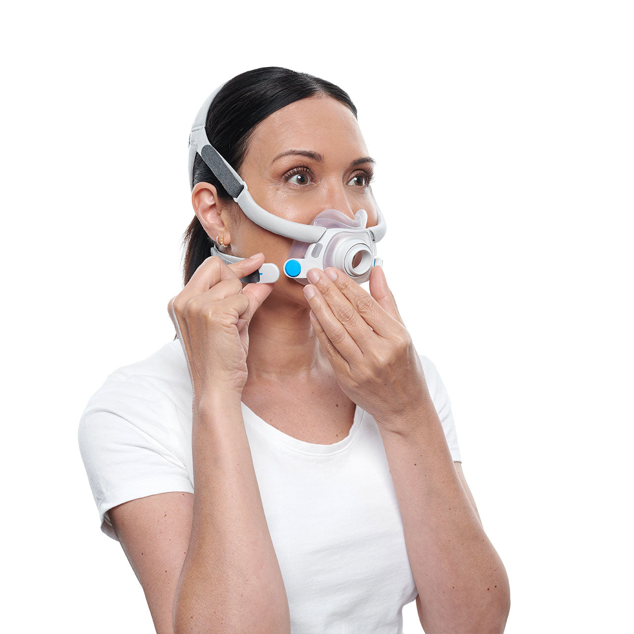 A woman clipping the headgear to the ResMed F40 mask
